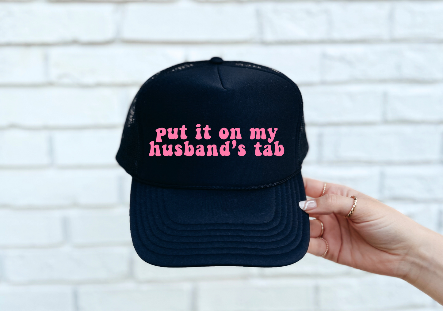 Put It On Husband's Tab Trucker Hat - Black