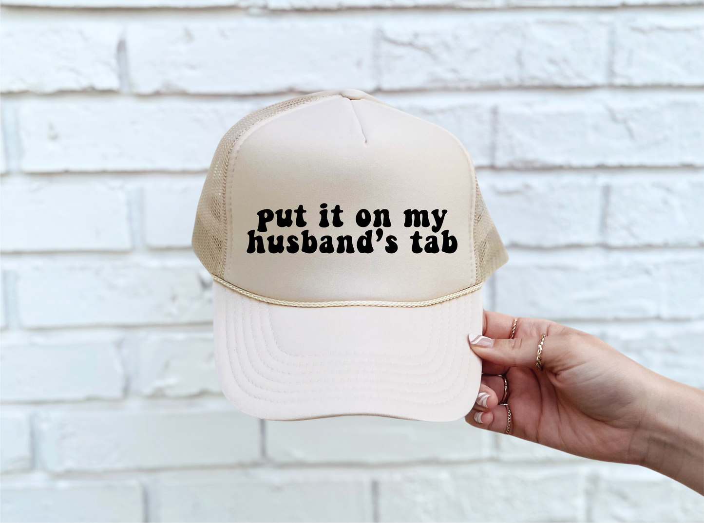 Put It On My Husband's Tab Trucker Hat - Tan